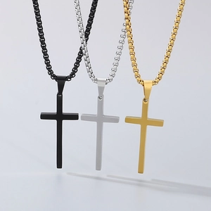 Set of three stainless steel cross necklaces in black, silver, and gold finish