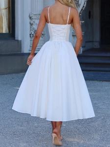 Elegant white satin midi dress featuring a slim strap and back lace-up detail design