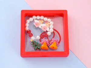 Christmas jewelry gift set with beads and charms in a red suspension display box