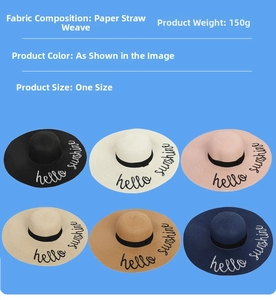 Flat lay of six colorful straw hats with black ribbons and Hello Sunshine embroidery