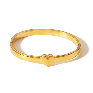 Minimalist 18K gold-plated stainless steel heart-shaped bangle with a polished finish