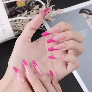 Long coffin french nails with nude pink base and hot pink tips in a stylish setup