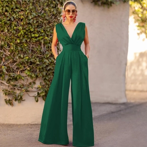 Detail of the high-waist sleeveless dark green jumpsuit with elegant wide-leg trousers