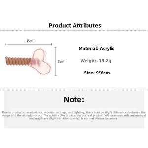 Détail d'élastique spirale marron avec décor cœur en acrylique rose 9x6cm 13,2g