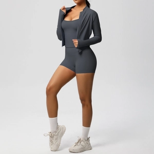 Three-piece dark grey yoga set with zipper jacket, sports bra, and high-waist shorts