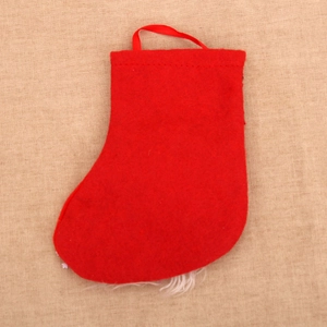 Detail of red felt Christmas stocking with a hanging loop and soft white plush trim