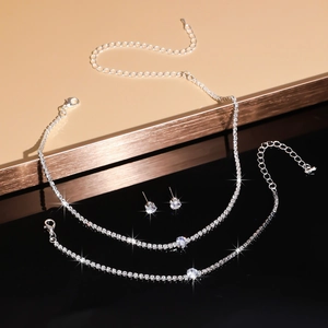 Detailed view of silver claw chain jewelry set with sparkling round zircon crystals