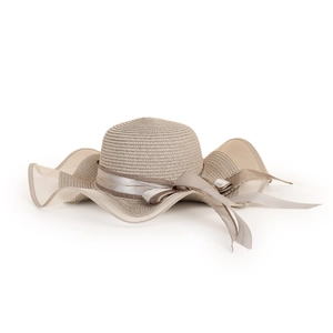 Detailed view of women straw sun hat featuring wavy mesh brim and heart print ribbon