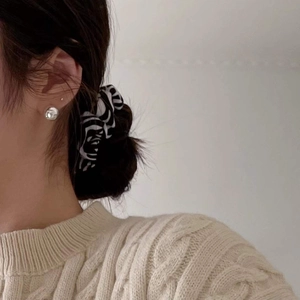Minimalist 925 sterling silver geometric stud earring shown on a model with a knit sweater