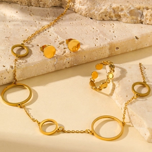 Minimalist gold ring, necklace and stud earrings set with circular geometric pendants