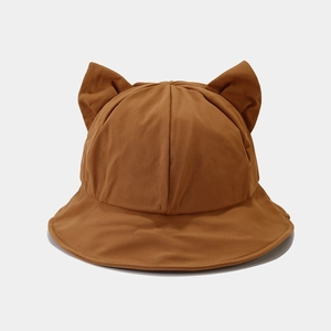 Detailed close-up of brown bucket hat with 3D cat ears made of twill cotton fabric