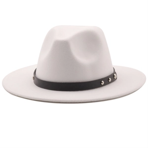 Close-up of white wool fedora hat featuring black leather band and silver rivet studs