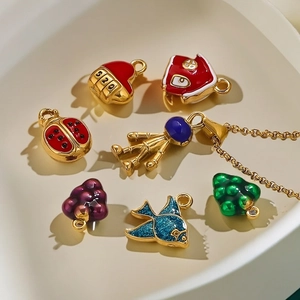 Colorful 3D enamel charms in ladybug and astronaut shapes for DIY jewelry making