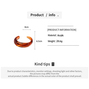 Detailed size specifications and material info for the amber acrylic open cuff bracelet