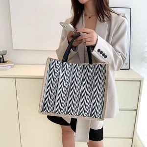 Large capacity striped canvas tote bag with black and white V-pattern for daily use