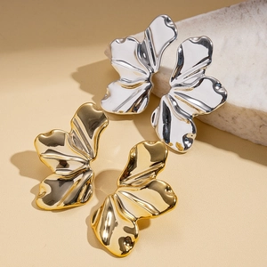 Modern gold and silver leaf earrings with abstract irregular liquid metal texture