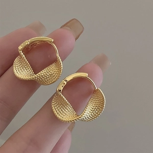 Pair of golden twist texture hoop earrings with woven metallic design for women