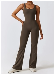 Detail view of dark brown yoga bodysuit featuring thin straps and trendy flare leg design