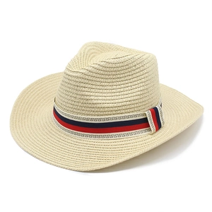 Men's straw panama hat in beige with red and blue greek key pattern ribbon trim