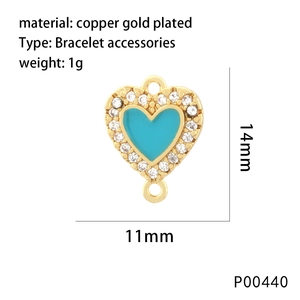 Macro detail of 11x14mm heart charm with sky blue enamel and micro-pave crystals