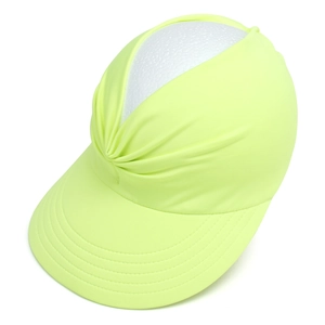 Close-up of neon yellow sun visor showing the wide brim and ruched athletic fabric