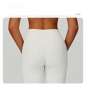 Detail of V-shaped back seam and ribbed fabric on high waist ivory yoga leggings
