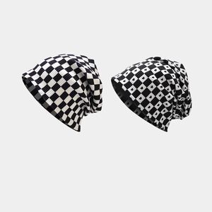 Classic checkerboard and heart pattern knitted slouchy beanies in black and white style