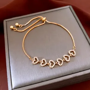 Gold-plated heart bracelet with white zircons and adjustable sliding ball clasp