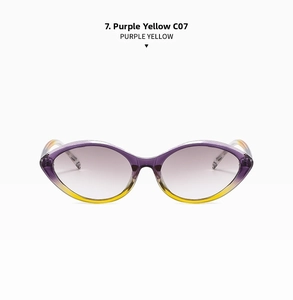 Detail view of cat eye sunglasses with purple and yellow gradient frames and light purple lenses