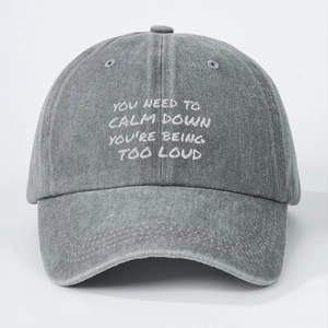 Washed grey denim baseball cap with white YOU NEED TO CALM DOWN embroidery