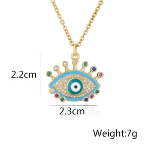 Detail view of evil eye pendant with blue enamel and colorful zircon, 2.3cm wide