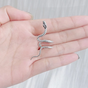S925 sterling silver snake ear cuff in polished finish held in hand showing size