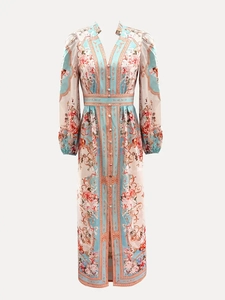 Detailed view of the elegant floral print maxi dress featuring a V-neck and puff sleeves