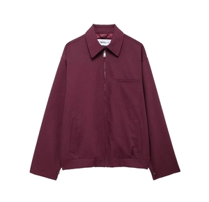 Detail of burgundy zip-up jacket featuring a lapel collar and functional chest pocket