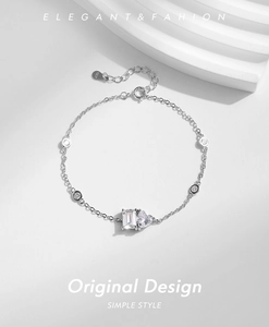 Close-up of S925 sterling silver bracelet with rectangle and heart-shaped zircon pendants