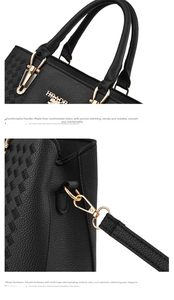 Detail of black pebbled leather handbag featuring diamond stitching and gold hardware