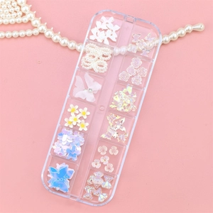 Detailed view of DIY nail art kit with assorted 3D bows, pearls and butterfly charms
