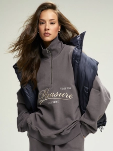 Gray half-zip sweatshirt with embroidery paired with a navy blue puffer vest set
