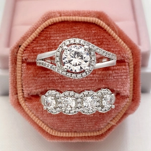 Luxury geometric engagement ring set with round halo diamond and pavé band in pink velvet box