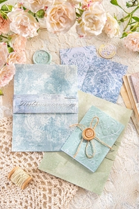Detailed close-up showing the relief texture of vintage floral scrapbooking paper
