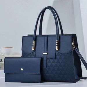Elegant navy blue two-piece tote bag set with geometric texture and gold hardware accessories