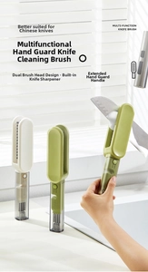 Close-up of U-shaped blade cleaning brush with dual bristles and sharpener in use