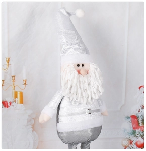 Close-up of silver sequined Santa Claus doll with long beard in festive home setting