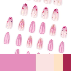 Pink cat eye almond press-on nails with red heart patterns and sparkling rhinestones