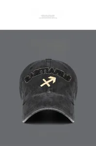 Macro shot of gold Sagittarius embroidery on vintage washed cotton baseball cap