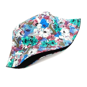 Close-up of vibrant floral print bucket hat with reversible black inner fabric lining