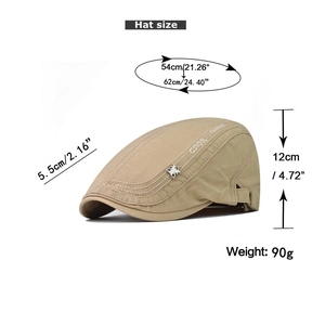 Detail of khaki Gatsby hat showing adjustable strap and GS10R print on fine cotton texture