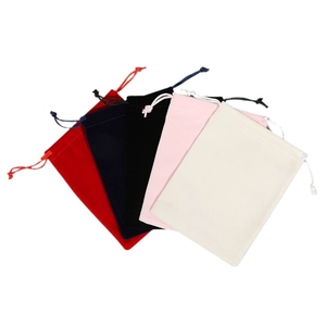 Thick velvet drawstring jewelry pouches in multiple colors including red and navy blue