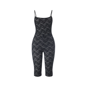 Detailed close-up of intricate floral lace patterns on a slim-fit black bodysuit