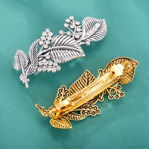 Retro leaf shape hair clips set in gold and silver finish with crystal rhinestones